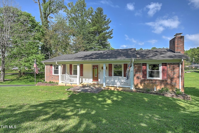 ranch-style house with a shingled roof, brick siding, a front yard, a chimney, and covered porch
