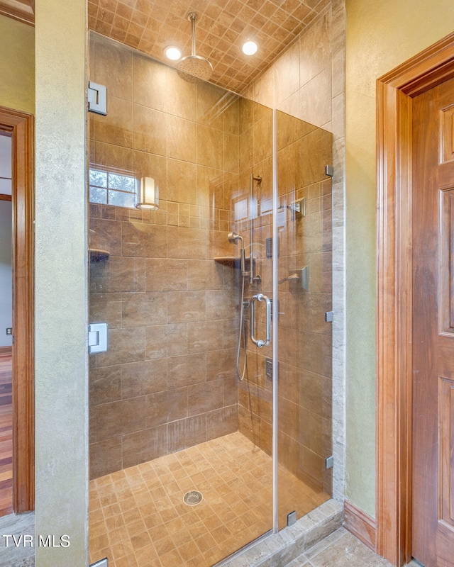 full bathroom with a stall shower
