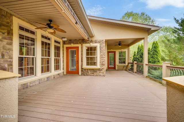 wooden terrace with a ceiling fan