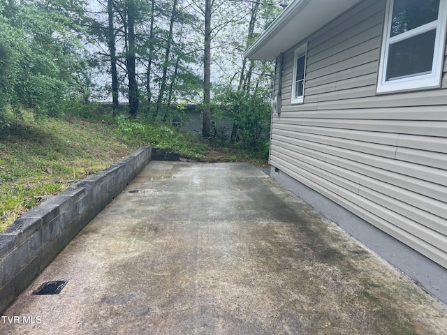 view of home's exterior with a patio area and crawl space