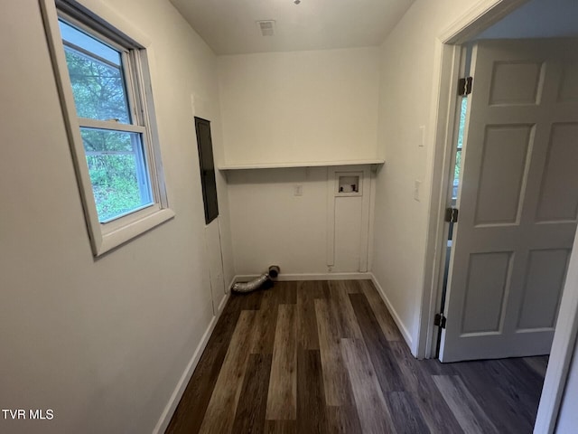 clothes washing area with dark wood-style floors, laundry area, hookup for a washing machine, visible vents, and baseboards