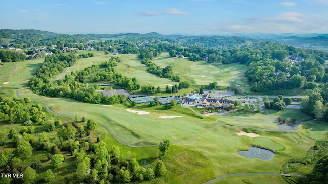 drone / aerial view with a mountain view and golf course view