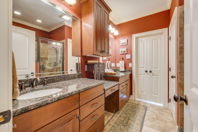 full bath featuring crown molding, tile patterned flooring, vanity, and a shower stall