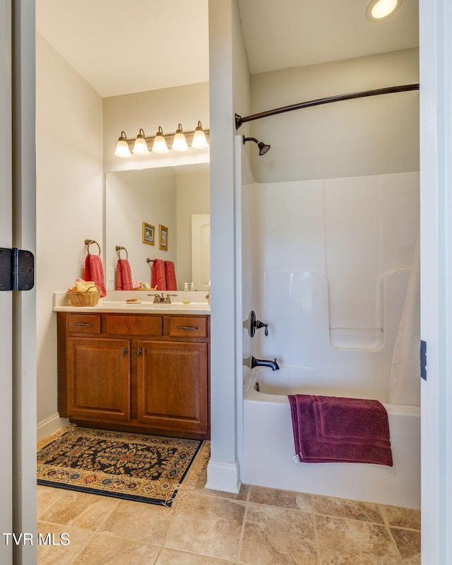 bathroom featuring shower / tub combination and vanity