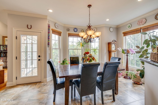 dining room with baseboards, ornamental molding, a chandelier, and recessed lighting