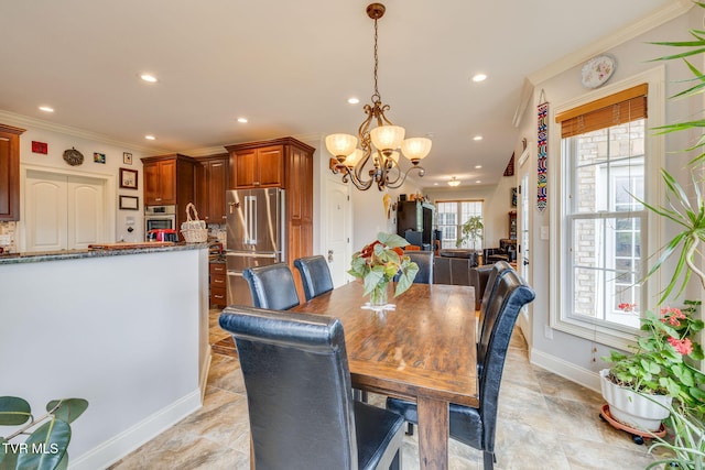 dining area with crown molding, recessed lighting, baseboards, and an inviting chandelier
