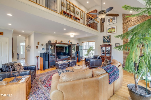 living area with recessed lighting, ornamental molding, light wood-style flooring, and ceiling fan