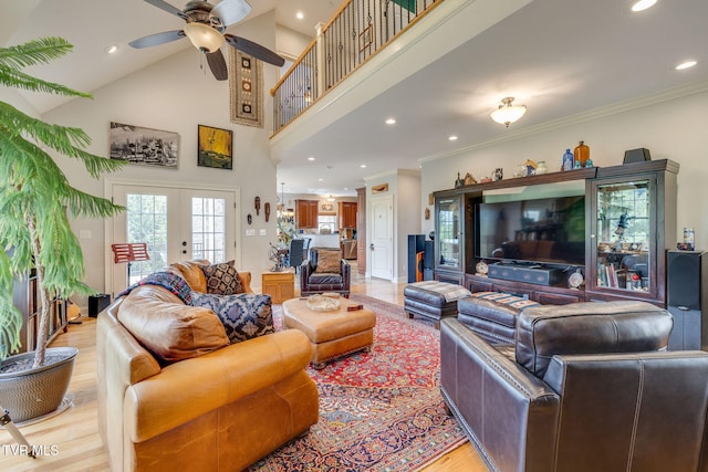 living room featuring french doors, a ceiling fan, ornamental molding, recessed lighting, and light wood-style flooring