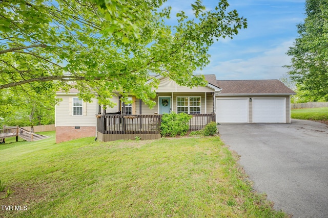 view of front of property with a garage, a porch, a front lawn, and driveway