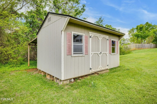 view of shed with fence