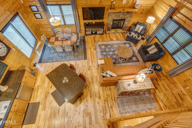 living room with wood walls and hardwood / wood-style floors