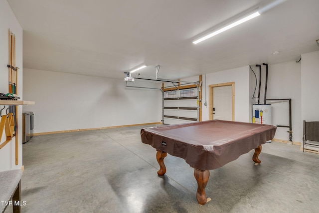 recreation room featuring a garage, pool table, concrete floors, and water heater