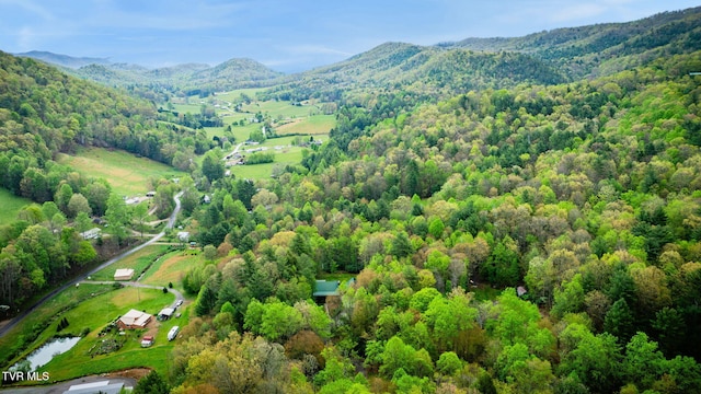 bird's eye view featuring a view of trees and a mountain view