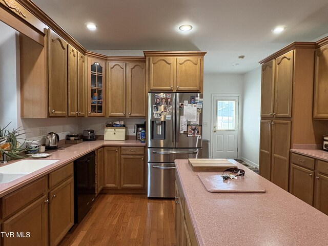 142 Oakwell Ln, Jonesborough, TN 37659 - kitchen featuring glass insert cabinets, a sink, black dishwasher, wood finished floors, and stainless steel fridge