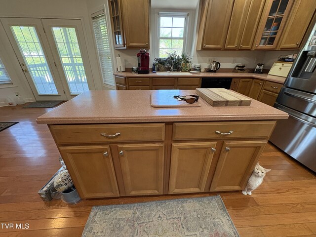 142 Oakwell Ln, Jonesborough, TN 37659 - kitchen with light wood-style floors, light countertops, refrigerator with ice dispenser, and a center island
