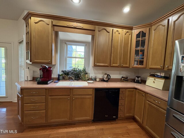 142 Oakwell Ln, Jonesborough, TN 37659 - kitchen featuring a sink, light wood finished floors, dishwasher, and light countertops
