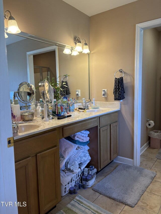 142 Oakwell Ln, Jonesborough, TN 37659 - full bathroom featuring a shower with shower door, double vanity, a sink, and tile patterned floors