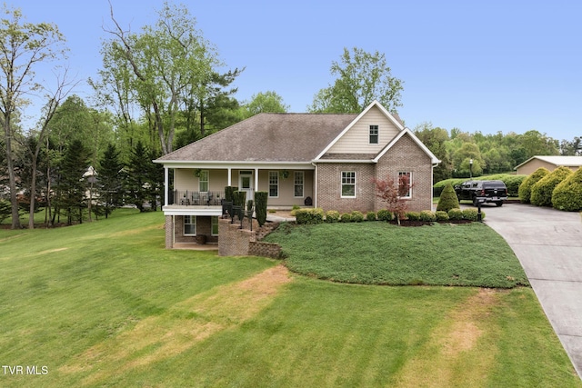 288 Max Jett Rd, Johnson City, TN 37601 - view of front of property featuring covered porch, brick siding, driveway, and a front lawn