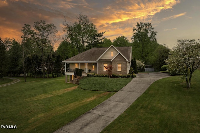 288 Max Jett Rd, Johnson City, TN 37601 - craftsman house featuring covered porch, brick siding, driveway, and a front lawn