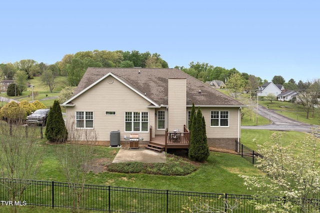 288 Max Jett Rd, Johnson City, TN 37601 - back of property featuring a chimney, a lawn, a wooden deck, cooling unit, and a fenced backyard