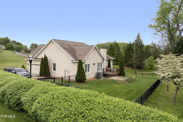 288 Max Jett Rd, Johnson City, TN 37601 - view of side of home featuring a yard, a deck, a chimney, and a fenced backyard