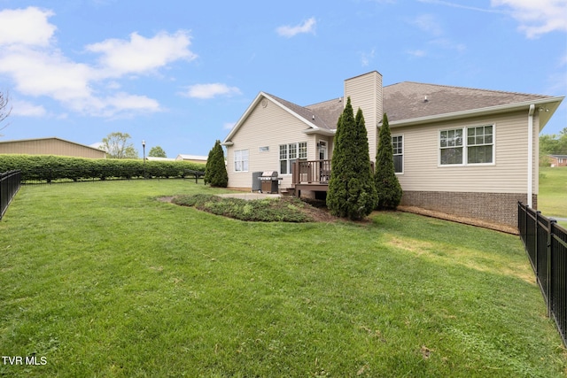 288 Max Jett Rd, Johnson City, TN 37601 - back of property with a fenced backyard, a yard, a chimney, and a deck