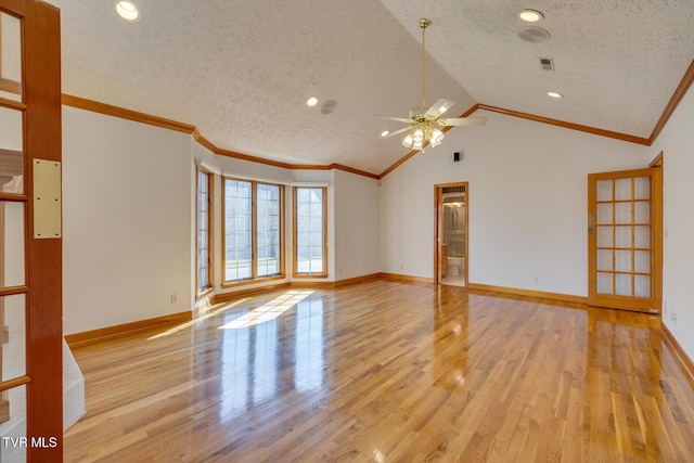 unfurnished room featuring crown molding, a textured ceiling, ceiling fan, and light wood-style floors