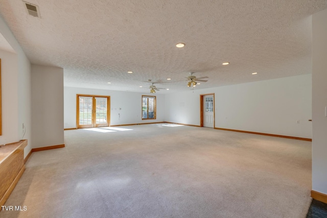 interior space featuring baseboards, recessed lighting, and a textured ceiling