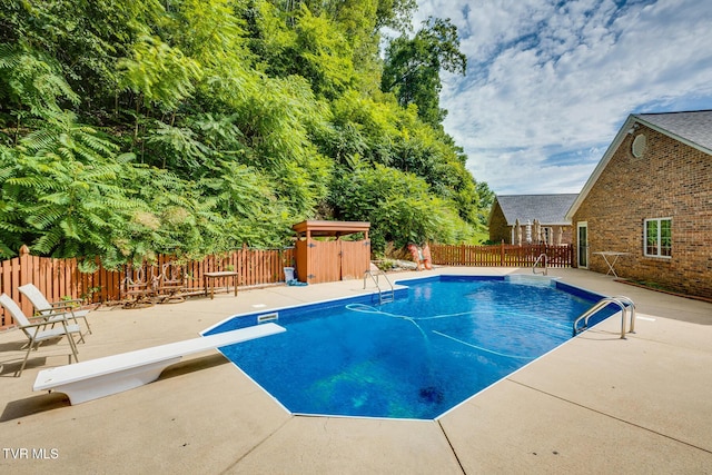 view of pool with a fenced backyard, a fenced in pool, and a patio area