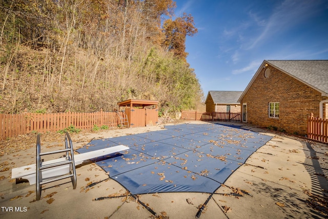 view of swimming pool featuring a patio, a fenced backyard, and a fenced in pool