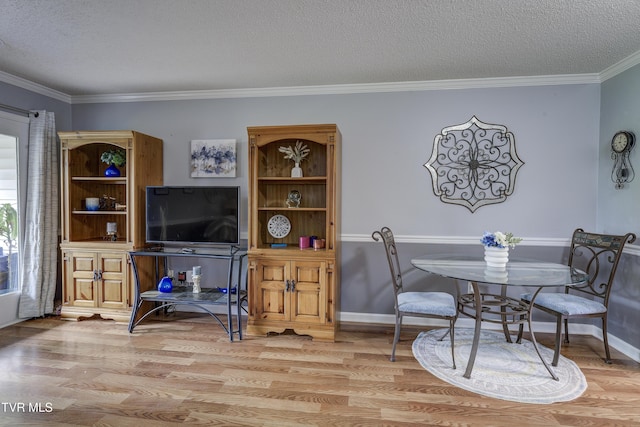 400 Sunset Dr Unit P83, Johnson City, TN 37604 - dining area featuring baseboards, light wood-style flooring, a textured ceiling, and ornamental molding