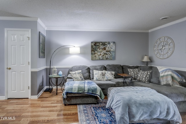 400 Sunset Dr Unit P83, Johnson City, TN 37604 - living room with a textured ceiling, visible vents, baseboards, light wood finished floors, and ornamental molding