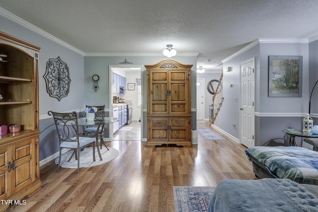 400 Sunset Dr Unit P83, Johnson City, TN 37604 - living area with ornamental molding, baseboards, stairway, a textured ceiling, and light wood-style flooring