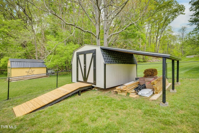 view of shed with a fenced backyard