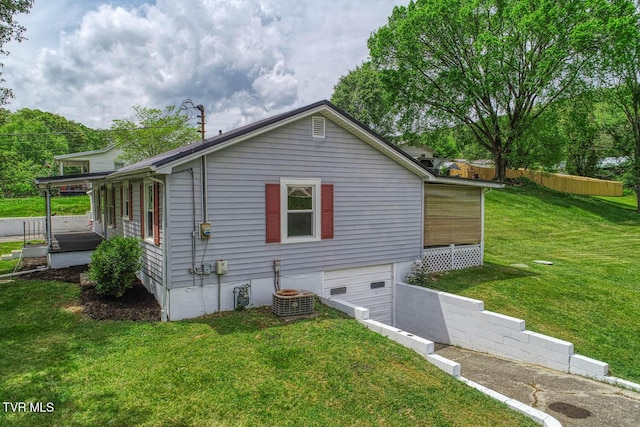 view of home's exterior featuring a yard and a garage