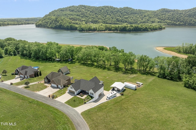 aerial view featuring a water view and a forest view