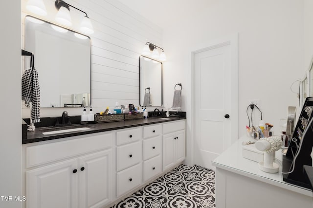 bathroom with a sink and double vanity