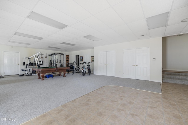 interior space featuring carpet flooring, a drop ceiling, pool table, and tile patterned floors