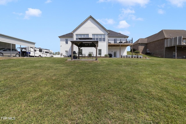 rear view of house with a lawn
