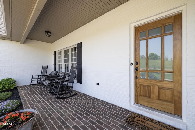 view of patio featuring a porch