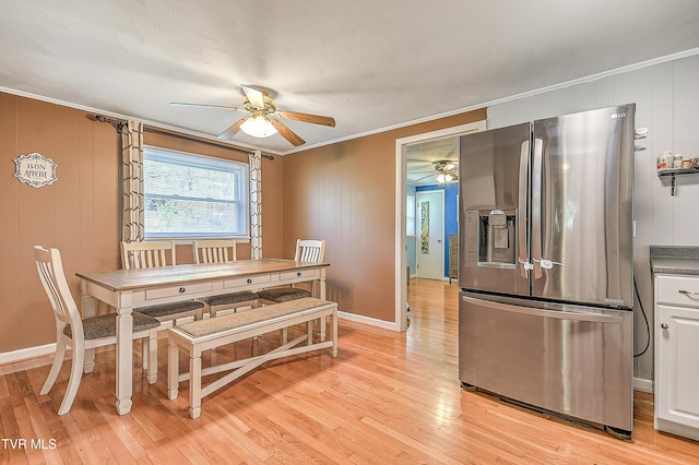 19032 Woodland Hills Rd, Abingdon, VA 24210 - dining area featuring light wood-style flooring, ceiling fan, ornamental molding, and baseboards