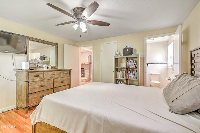 19032 Woodland Hills Rd, Abingdon, VA 24210 - bedroom with ceiling fan, light wood-type flooring, and ensuite bath