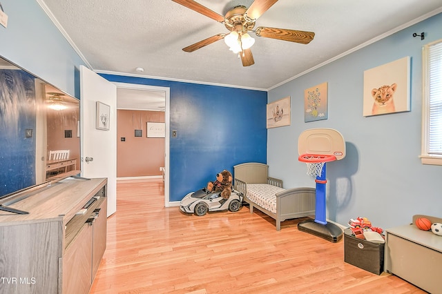 19032 Woodland Hills Rd, Abingdon, VA 24210 - sitting room featuring ornamental molding, light wood finished floors, a ceiling fan, and baseboards