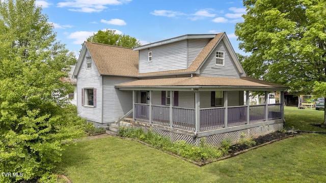 302 Wilson Ave, Johnson City, TN 37604 - back of house with a porch, a yard, and a shingled roof