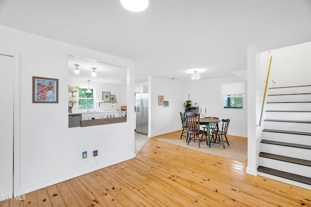 302 Wilson Ave, Johnson City, TN 37604 - dining area with light wood-style floors, baseboards, and stairs