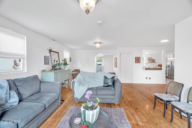 302 Wilson Ave, Johnson City, TN 37604 - living room featuring arched walkways, visible vents, and light wood-type flooring