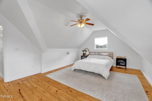 302 Wilson Ave, Johnson City, TN 37604 - bedroom with baseboards, a ceiling fan, vaulted ceiling, and light wood-type flooring