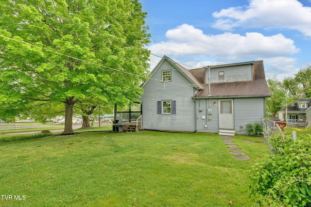 302 Wilson Ave, Johnson City, TN 37604 - back of property featuring a yard and a shingled roof