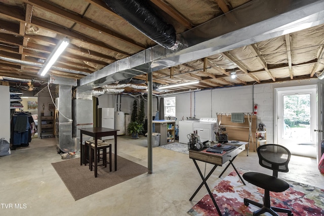 2004 Old Tusculum Rd, Greeneville, TN 37745 - below grade area featuring heating unit, a wealth of natural light, gas water heater, and washing machine and clothes dryer