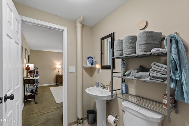 2004 Old Tusculum Rd, Greeneville, TN 37745 - bathroom with baseboards, a sink, and toilet